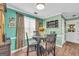 Charming dining area with a table, seating for four, and natural light, creating an inviting space for meals at 3511 Cherry Blossom Ct, Loganville, GA 30052