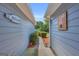 Exterior view of a home with mature landscaping, a walkway, and a 'Welcome' sign at 3511 Cherry Blossom Ct, Loganville, GA 30052