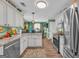 Spacious kitchen featuring white cabinets, stainless steel appliances, breakfast area, and plenty of counter space at 3511 Cherry Blossom Ct, Loganville, GA 30052