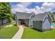 View of the community pool house featuring covered picnic tables, storage area, and easy access to the pool at 3511 Cherry Blossom Ct, Loganville, GA 30052
