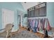Large walk-in closet with custom shelving, hanging racks, and an abundance of storage space at 3511 Cherry Blossom Ct, Loganville, GA 30052