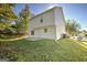 Spacious backyard of house with trees at 1399 Cutters Mill Dr, Lithonia, GA 30058