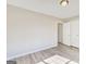 This bedroom features hardwood floors, a closet, neutral paint, and natural light at 1399 Cutters Mill Dr, Lithonia, GA 30058