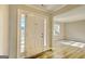 Bright entryway with wood floors and a view into a spacious living area at 1399 Cutters Mill Dr, Lithonia, GA 30058