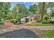 Landscaped backyard featuring a pool, wooden bridges, and meticulously maintained mulch beds at 522 Golfview, Peachtree City, GA 30269