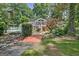 Lush backyard with a wooden bridge, pool, and meticulous landscaping enhancing the serene atmosphere at 522 Golfview, Peachtree City, GA 30269