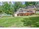 Spacious backyard with large windows, a pool with a slide and a wooden patio at 522 Golfview, Peachtree City, GA 30269