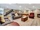 Spacious basement featuring a lounge area with a large rug, fireplace, and a pool table, ideal for recreation at 522 Golfview, Peachtree City, GA 30269
