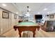 The basement features a pool table, wood-look floors, stylish decor, and modern recessed lighting at 522 Golfview, Peachtree City, GA 30269