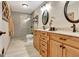 Updated bathroom with dual vanities, granite countertop, tiled shower, and modern fixtures at 522 Golfview, Peachtree City, GA 30269