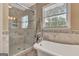 Bathroom showcasing a standalone tub, glass shower, and stylish tile work at 522 Golfview, Peachtree City, GA 30269