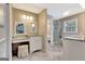 Bright bathroom featuring herringbone floors, dual sinks, vanity, and glass shower at 522 Golfview, Peachtree City, GA 30269