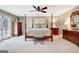 Bedroom with four-poster bed, ceiling fan, carpet, and natural light at 522 Golfview, Peachtree City, GA 30269
