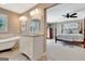 Open concept primary bedroom and ensuite bath featuring herringbone floors at 522 Golfview, Peachtree City, GA 30269