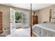 Bedroom with four-poster bed and french doors leading to an outdoor pool and patio at 522 Golfview, Peachtree City, GA 30269