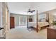 Bedroom with four-poster bed, ceiling fan, carpet, and french doors to the outside at 522 Golfview, Peachtree City, GA 30269