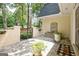 Charming courtyard featuring a stone fountain, potted plants, and a welcoming entrance mat adds character at 522 Golfview, Peachtree City, GA 30269