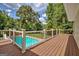 Spacious deck area overlooking the sparkling swimming pool and the lush landscaped backyard at 522 Golfview, Peachtree City, GA 30269