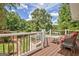 Spacious deck area offering serene views of the lush greenery, swimming pool, and landscaped backyard at 522 Golfview, Peachtree City, GA 30269