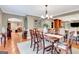 Elegant dining room with hardwood floors, chandelier, and views into the kitchen at 522 Golfview, Peachtree City, GA 30269