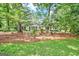 A ranch-style home is surrounded by lush greenery, creating a secluded and tranquil setting at 522 Golfview, Peachtree City, GA 30269