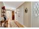 Bright hallway with hardwood floors, glass paneled doors, and neutral walls showcasing classic charm at 522 Golfview, Peachtree City, GA 30269