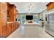 Spacious kitchen with stainless steel appliances, custom cabinets, and a large center island at 522 Golfview, Peachtree City, GA 30269