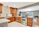 Kitchen with stainless steel appliances, custom cabinets, marble flooring, and an adjoining dining area at 522 Golfview, Peachtree City, GA 30269