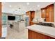 Bright, open kitchen with stainless steel appliances, custom wood cabinets, and a center island at 522 Golfview, Peachtree City, GA 30269