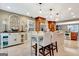 Bright kitchen featuring custom cabinets, stainless steel appliances, marble flooring, and cozy breakfast nook at 522 Golfview, Peachtree City, GA 30269
