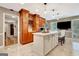 Bright kitchen features a large center island, custom wood cabinets, stainless appliances, and marble floors at 522 Golfview, Peachtree City, GA 30269