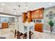 Bright kitchen features an island with seating, sleek marble floors, and custom wood cabinetry at 522 Golfview, Peachtree City, GA 30269