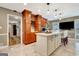 Bright kitchen featuring a large center island, custom wood cabinets, stainless appliances, and marble floors at 522 Golfview, Peachtree City, GA 30269