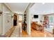 Entryway leading into a cozy living room with fireplace and plenty of natural light at 522 Golfview, Peachtree City, GA 30269