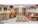 Cozy living room with decorative wood paneling and hardwood floors at 522 Golfview, Peachtree City, GA 30269