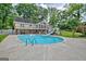 Inviting backyard features a large in-ground pool with a slide, perfect for summer fun and relaxation at 522 Golfview, Peachtree City, GA 30269