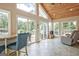 Bright sunroom with tile floors, wood ceiling, and multiple windows providing ample natural light at 522 Golfview, Peachtree City, GA 30269