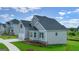 Beautifully designed home with a two-car garage and well-manicured lawn, set in a residential neighborhood at 13709 Whitman Ln, Covington, GA 30014