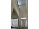 Bright foyer with high ceilings, white staircase, and a view into the adjacent room at 13709 Whitman Ln, Covington, GA 30014