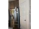 Stainless steel refrigerator and cabinetry, enhancing the modern kitchen design at 13709 Whitman Ln, Covington, GA 30014