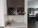 Kitchen featuring custom wine rack on counter, stainless steel appliances, and an open layout at 13709 Whitman Ln, Covington, GA 30014