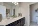 Bathroom featuring double sink vanity, large mirror, and modern fixtures at 313 Westfall Ter # 225A, Loganville, GA 30052