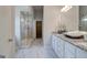 Open bathroom featuring marble floors, double vanity, and spacious shower at 313 Westfall Ter # 225A, Loganville, GA 30052