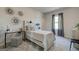 Cozy bedroom decorated with modern artwork, a comfortable bed, and soft carpet at 313 Westfall Ter # 225A, Loganville, GA 30052