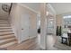 Bright entryway with hardwood floors, staircase, and ample natural light from nearby windows at 313 Westfall Ter # 225A, Loganville, GA 30052