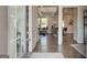 Inviting entryway with hardwood floors, wainscoting, and views into the living and dining areas at 313 Westfall Ter # 225A, Loganville, GA 30052