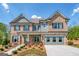 Charming two-story home with brick and siding exterior, landscaped yard, and inviting front porch at 313 Westfall Ter # 225A, Loganville, GA 30052