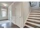 Welcoming entryway featuring hardwood floors and staircase at 313 Westfall Ter # 225A, Loganville, GA 30052