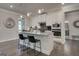 Stylish kitchen featuring granite countertops, a center island with seating, and stainless steel appliances at 313 Westfall Ter # 225A, Loganville, GA 30052