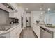 Modern kitchen with stainless steel appliances, granite countertops, and ample cabinet space at 313 Westfall Ter # 225A, Loganville, GA 30052